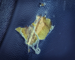 Torn leather seat