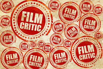 Obraz premium film critic, red stamp on a grunge paper texture