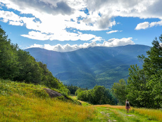 Sunrays Beam Down as a Hiker Descends 