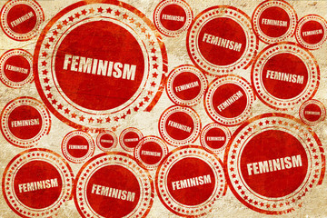 feminism, red stamp on a grunge paper texture