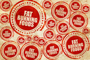 fat burning foods, red stamp on a grunge paper texture