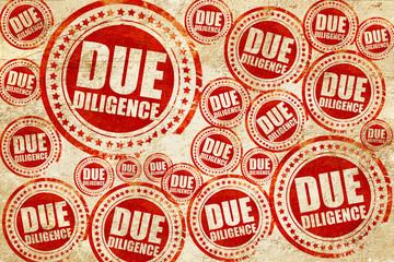 due diligence, red stamp on a grunge paper texture