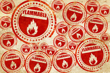 Flammable hazard sign, red stamp on a grunge paper texture