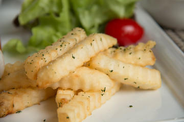 French Fries with container on plate