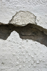 very old wall with a crack on it