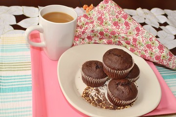 Chocolate muffins and a cup of coffee