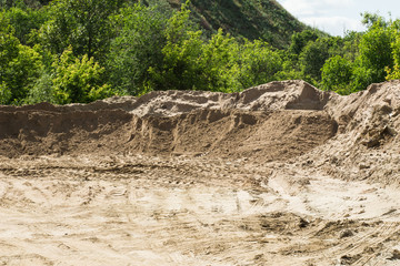 Fototapeta na wymiar Small sand pit. The ecological problem of small towns. Soil erosion and the destruction of parks. Volgograd city.