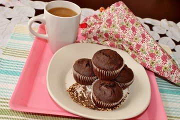 Chocolate muffins and a cup of coffee