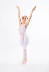 Obraz premium Little girl is dancing on a white background