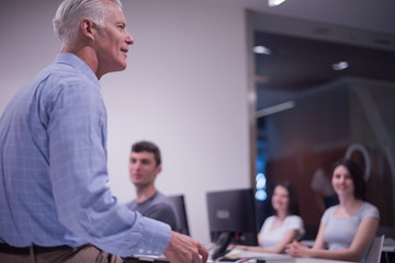 teacher and students in computer lab classroom
