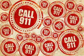 call 911, red stamp on a grunge paper texture