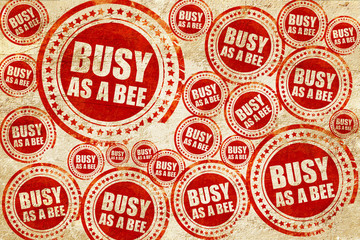 busy as a bee, red stamp on a grunge paper texture
