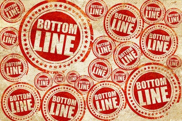 bottom line, red stamp on a grunge paper texture