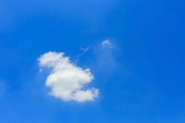 fluffy cloud on clear blue sky