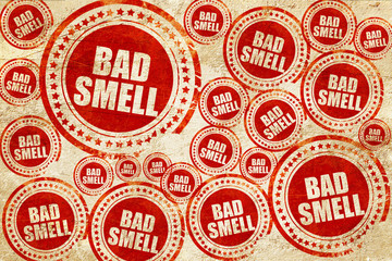 bad smell, red stamp on a grunge paper texture