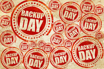 Obraz premium backup day, red stamp on a grunge paper texture