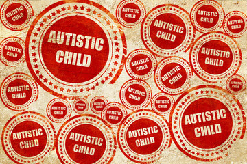 Obraz premium Autistic child sign, red stamp on a grunge paper texture