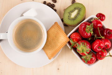 Hot coffee, cake and fruits on wooden table, flat lay