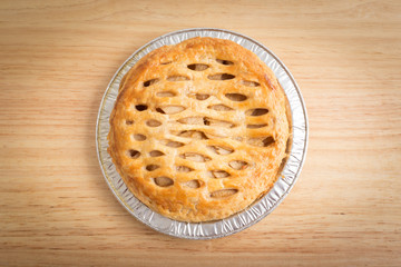 Apple pie on wooden board
