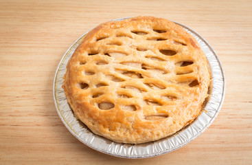 Apple pie on wooden board