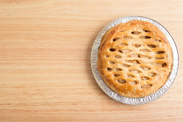 Apple pie on wooden board