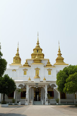 Golden and white pagoda with the blue sky, Thailand
