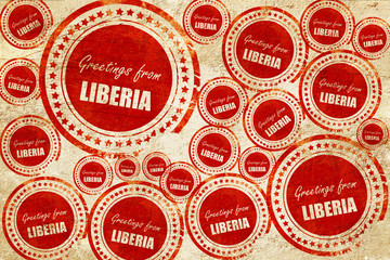 Obraz premium Greetings from liberia, red stamp on a grunge paper texture