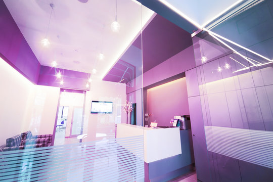 Lobby entrance with reception desk in a dental clinic.