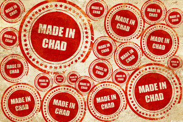 Made in chad, red stamp on a grunge paper texture