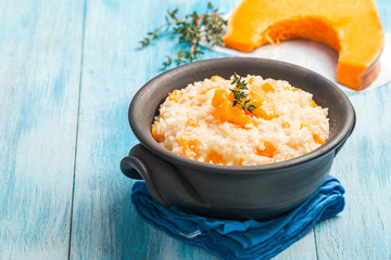 rice with pumpkin in a clay bowl