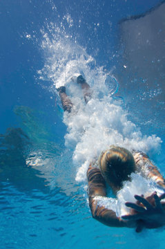 Diver entering water, underwater shot