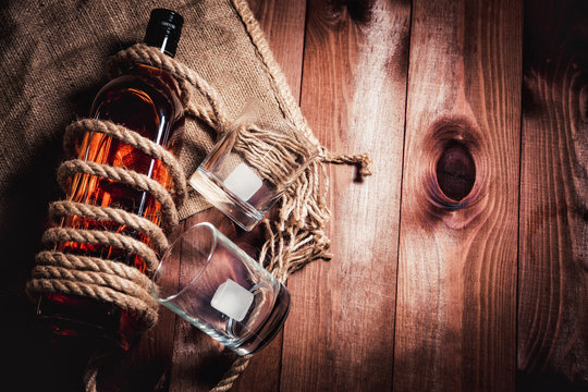 whiskey aged elite alcohol on wooden background