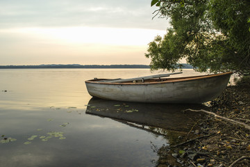 Summer solar landscape;, coast lake and boat