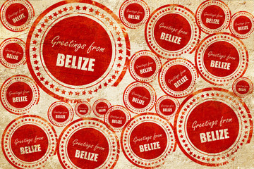 Greetings from belize, red stamp on a grunge paper texture
