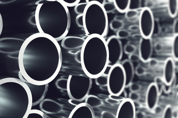 Heap of shiny metal steel pipes with selective focus effect. 3d illustration