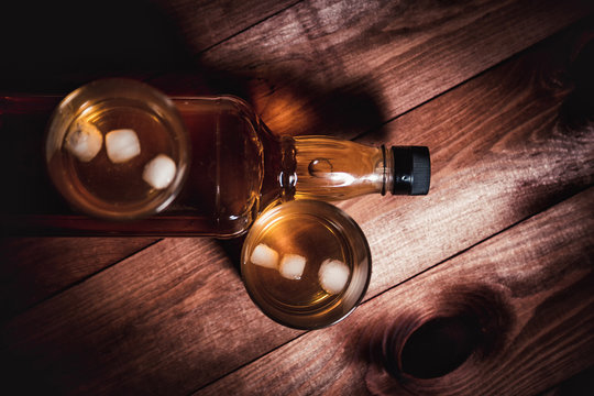 whiskey aged elite alcohol on wooden background
