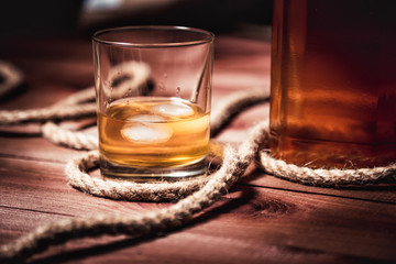 whiskey aged elite alcohol on wooden background