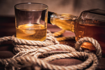 whiskey aged elite alcohol on wooden background