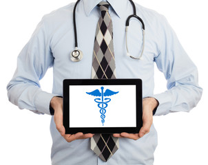 Doctor holding tablet - Caduceus symbol