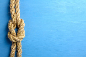 knot on blue wooden background