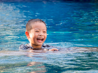 Fototapeta na wymiar little asian boy in swimming suit