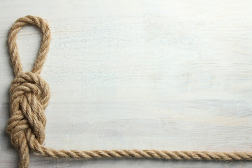 knot on white wooden background