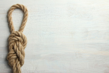 knot on white wooden background