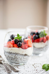 chia seeds in yogurt with granola, yogurt and strawberries, blue