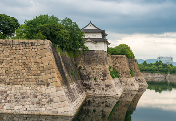 Walls of Osaka Castle with water reflections © jovannig