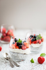 chia seeds in yogurt with granola, yogurt and strawberries, blue