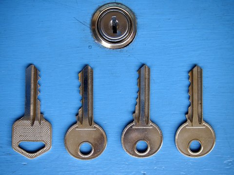 Keys and a keyhole on a blue door