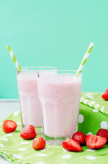 
Summer refreshing cold drink , a milkshake with strawberries on a bright color background