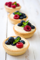 Delicious tartlets with raspberries and blueberries
