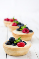 Delicious tartlets with raspberries and blueberries
